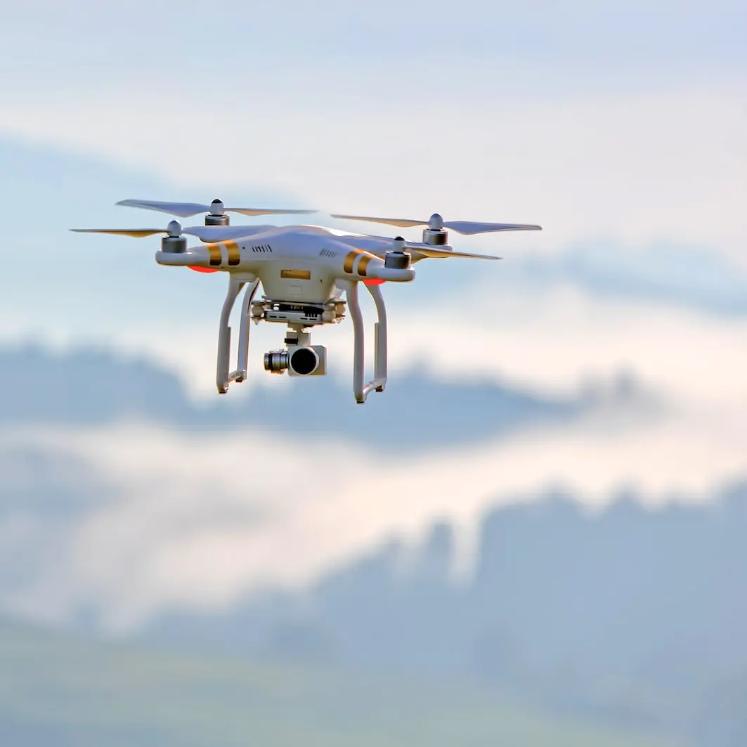 shallow focus photo of white quadcopter